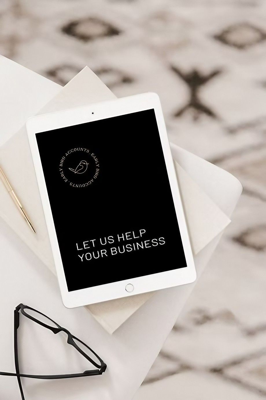 A Tablet with The Words Let Us Help Your Business on It — Early Bird Accounts in Tamworth, NSW