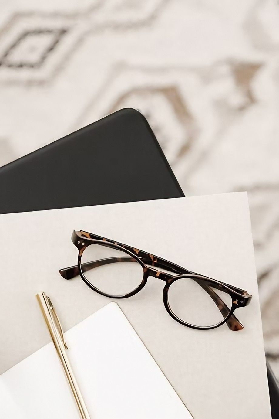A Pair of Glasses Is Sitting on Top of A Notebook Next to A Pen — Early Bird Accounts in Tamworth, NSW