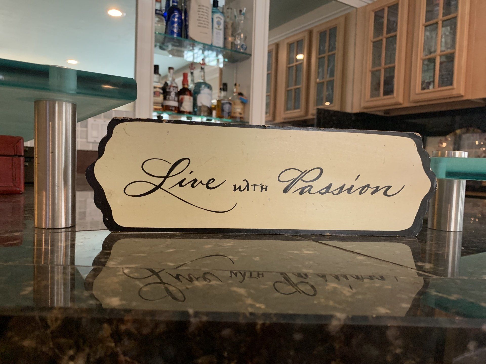 A sign on a counter that says live with passion