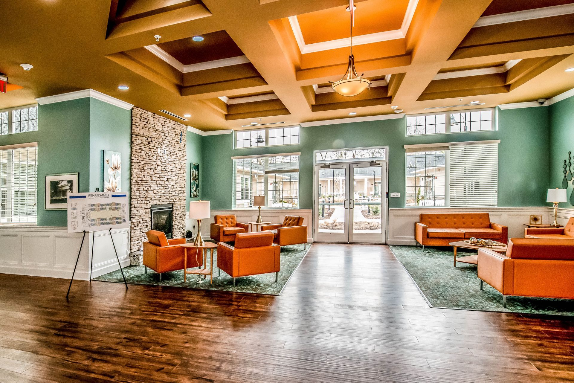 A large living room with a lot of furniture and a fireplace.