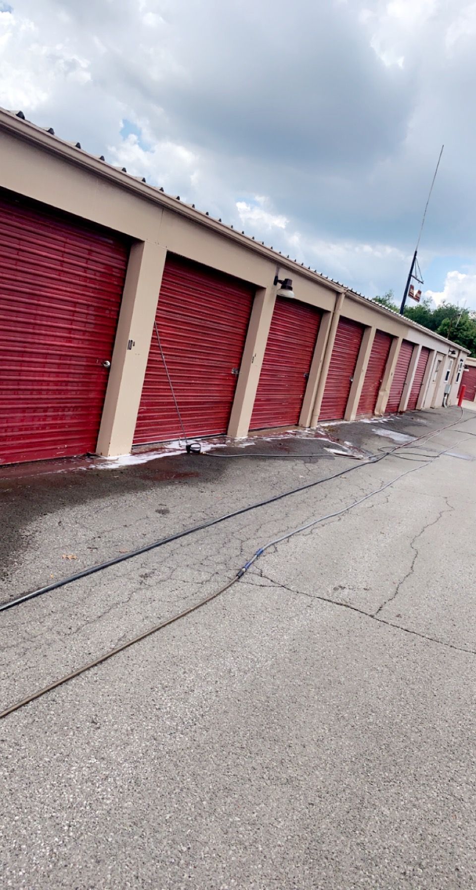 Wet Red Garage Door - Irwin, PA - Clean and Serene Pressure Washing