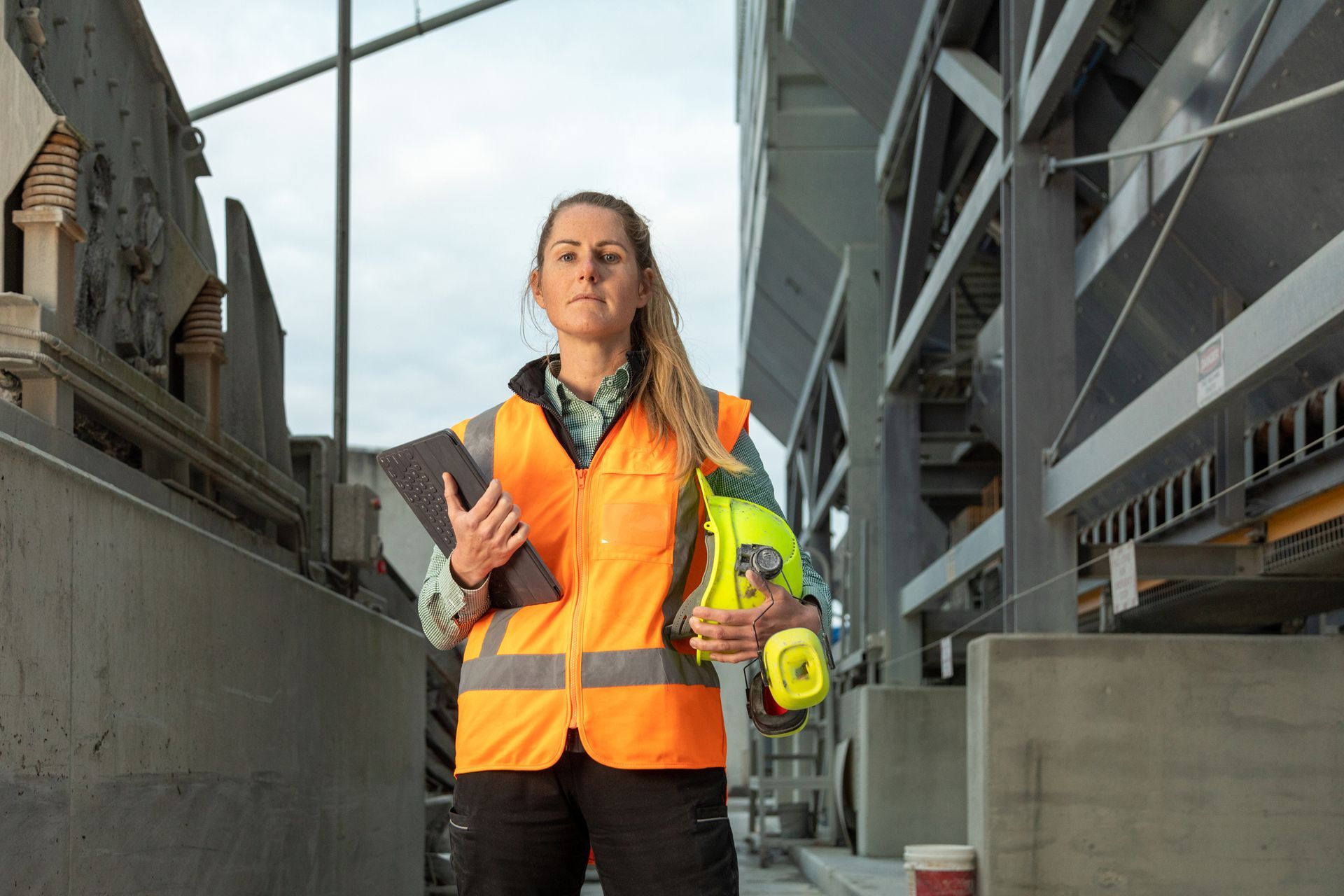 A female concrete construction contractor at a concrete manufacturing plant  A female concrete construction contractor at a concrete manufacturing plant