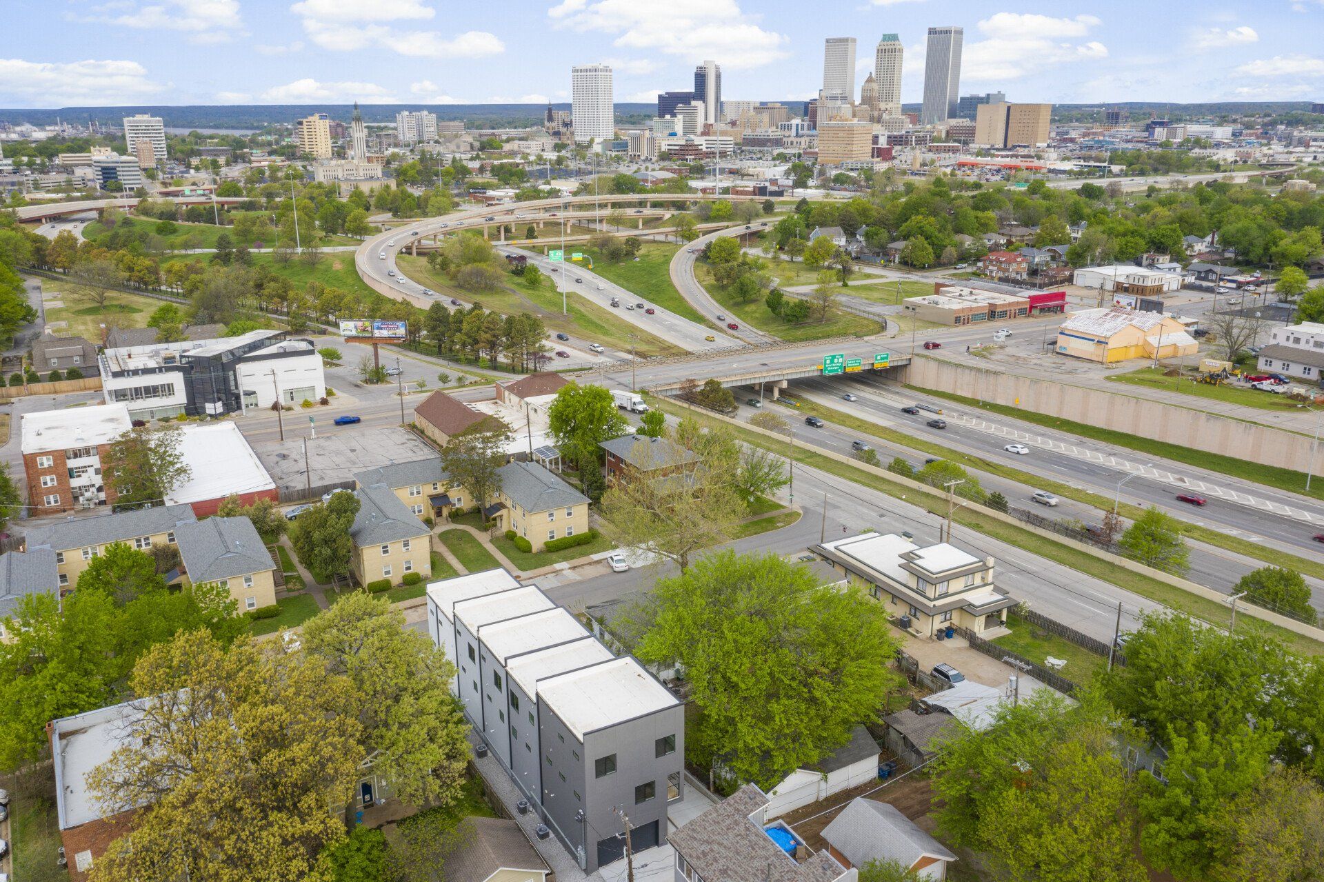 An aerial view of a city with a lot of buildings and trees.