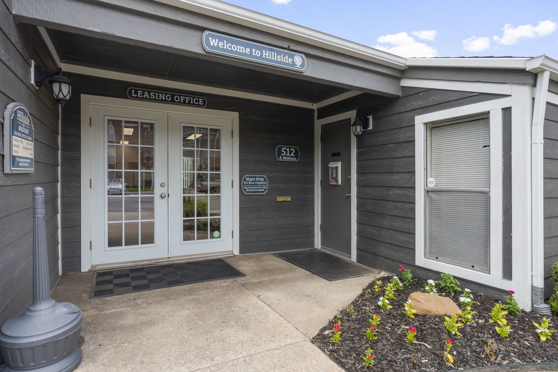 The entrance to a building with a lot of windows and doors.