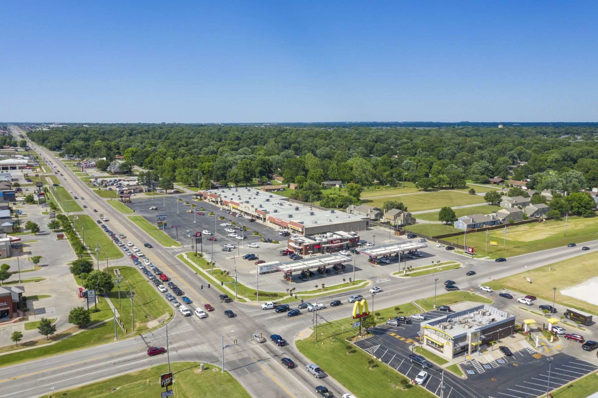 An aerial view of a busy intersection with a mcdonald 's restaurant.