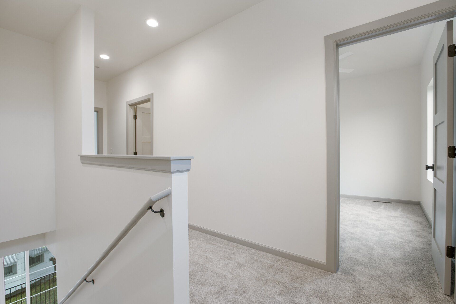 There is a staircase leading up to the second floor of a house.