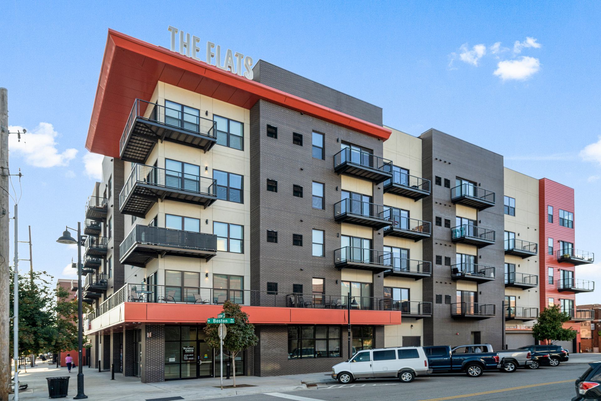 A living room with two couches , a coffee table , and a television.