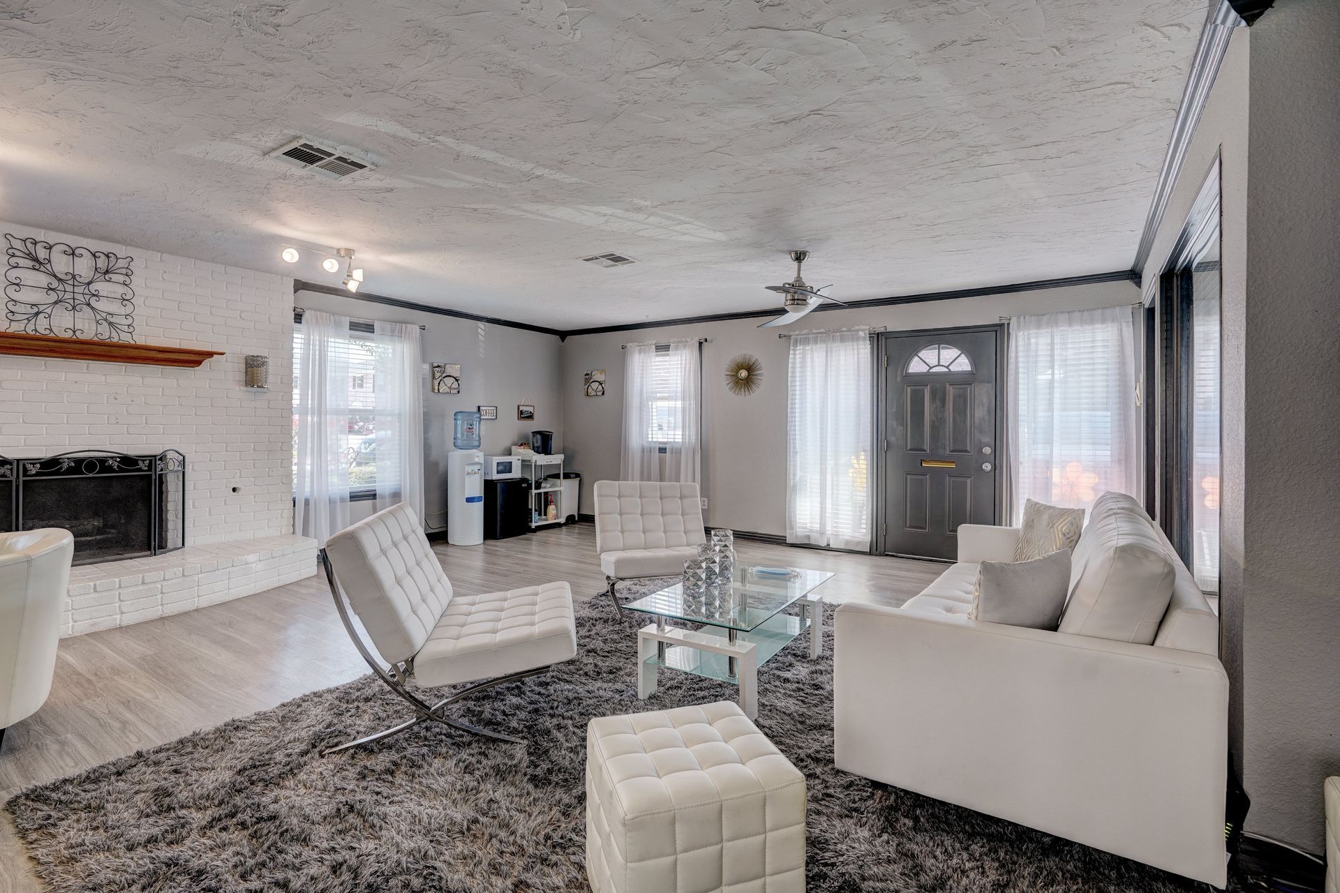 A living room filled with furniture and a fireplace.