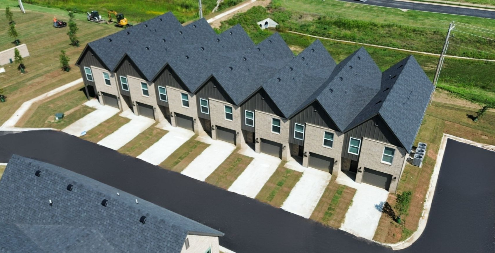 An artist 's impression of a row of houses with cars parked in front of them.