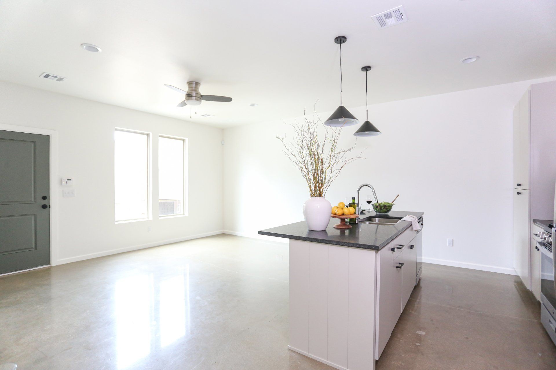 A kitchen with a large island in the middle of the room.