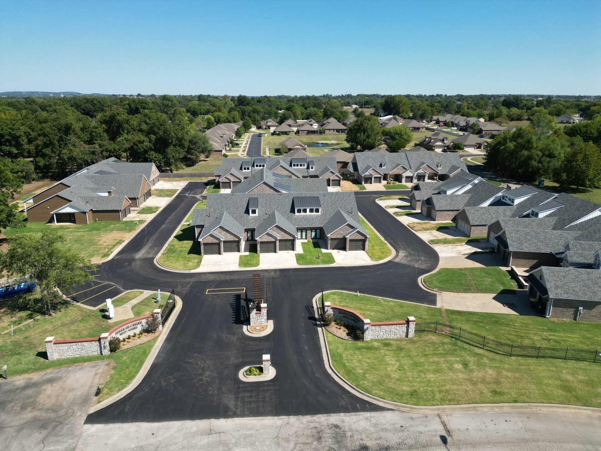 An aerial view of a residential area with lots of houses and trees