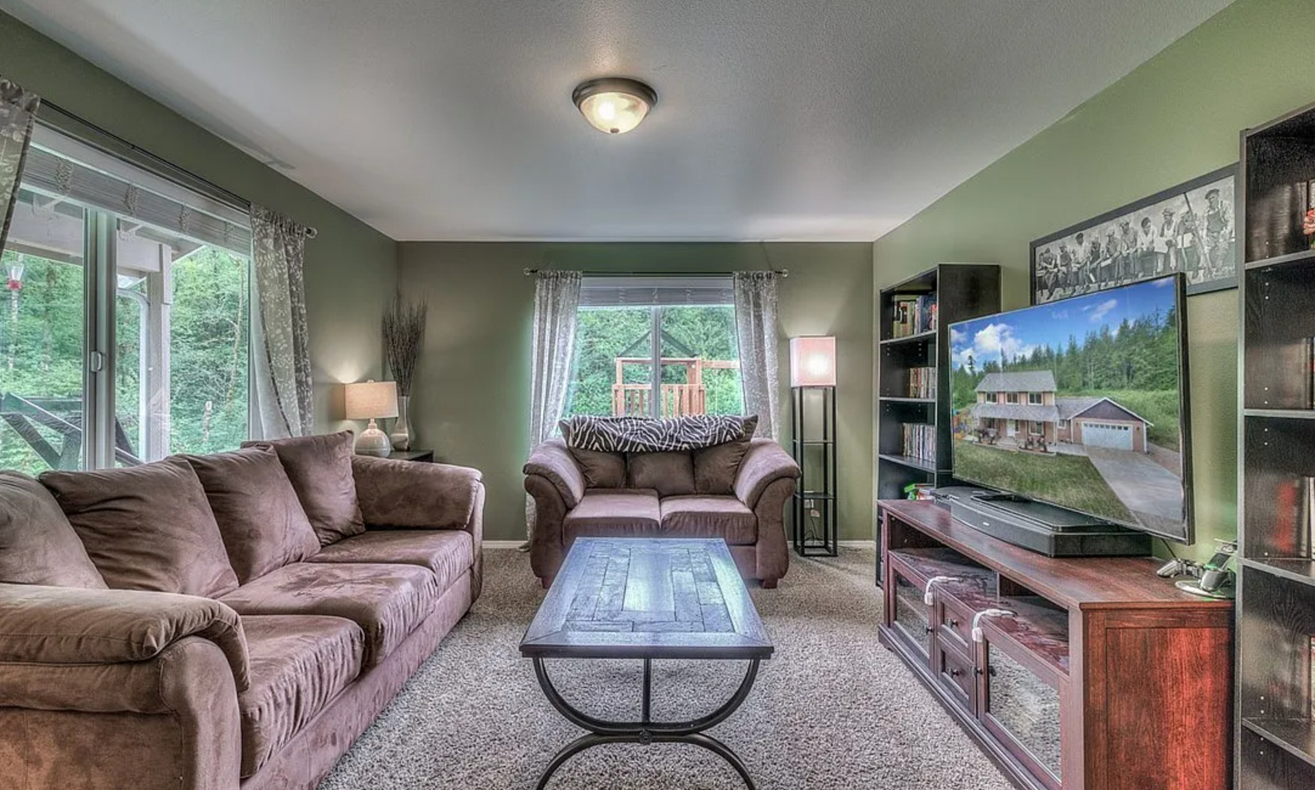 A living room filled with furniture and a flat screen tv.