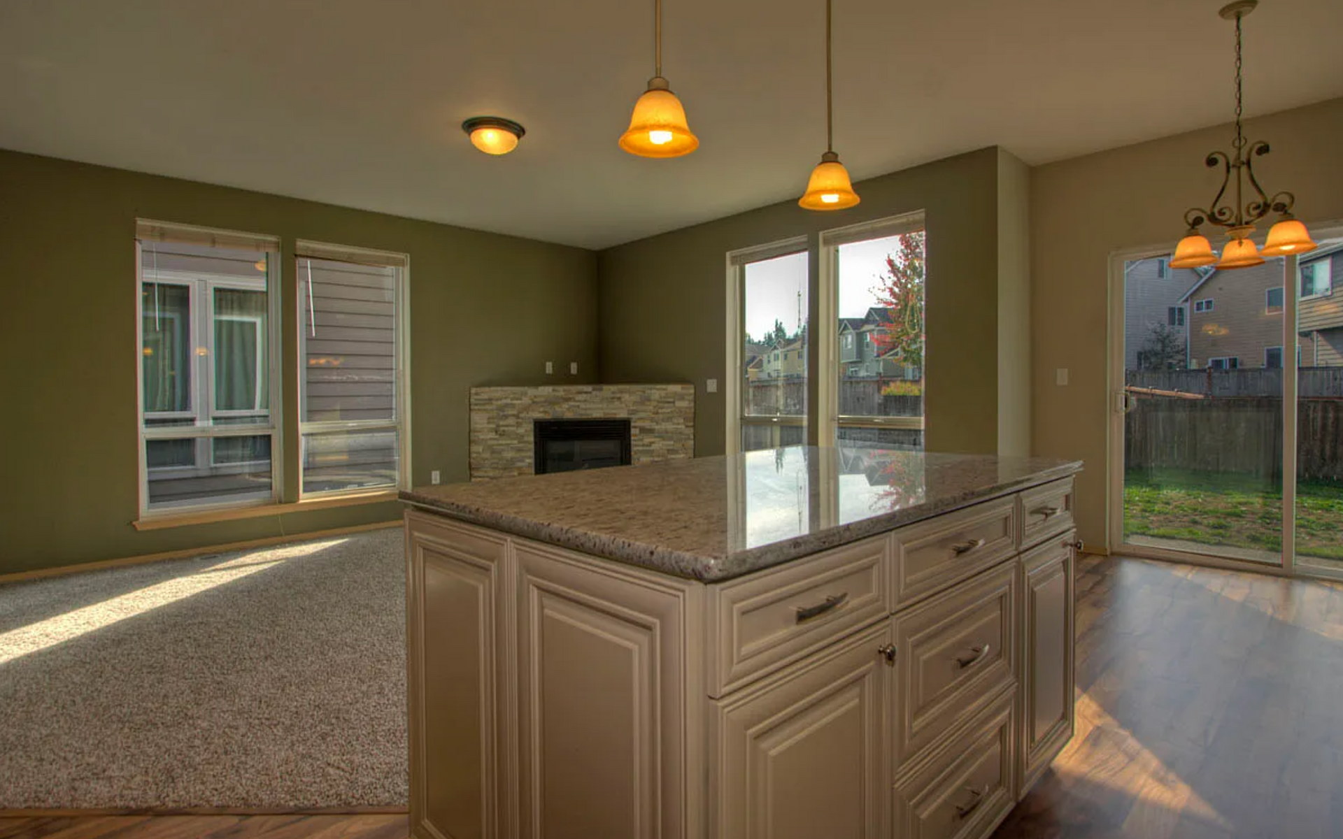 There is a large island in the middle of the kitchen.