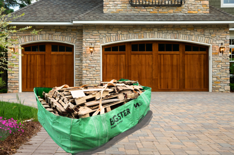 Driveway with waste management bag filled with debris and wood