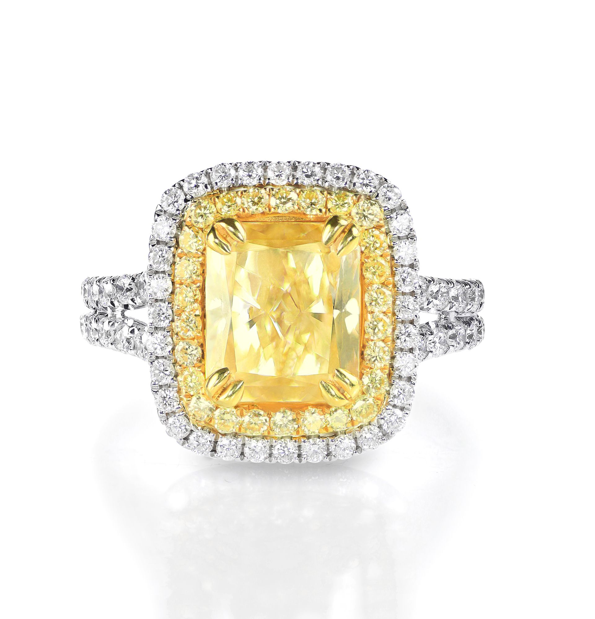 White gold diamond ring containing in the center a 4 Ct. radiant fancy yellow diamond