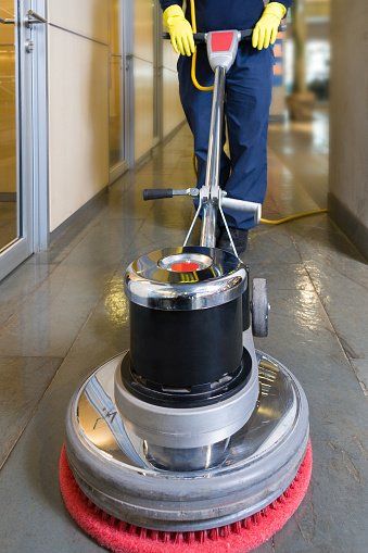 Worker cleaning floor using machine cleaner - Flooring Care & Maintenance in Santa Cruz, CA
