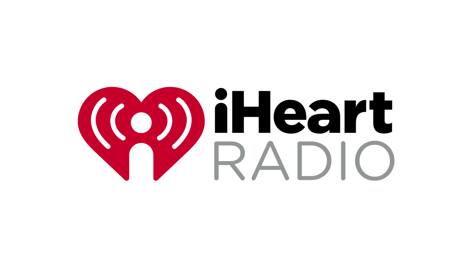 The logo for iheart radio is a red heart with a white circle in the middle.