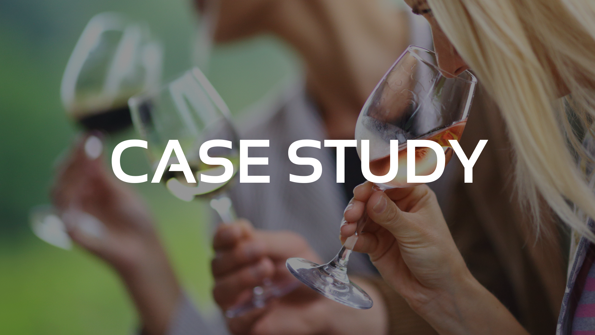 A man and a woman are holding wine glasses in their hands.