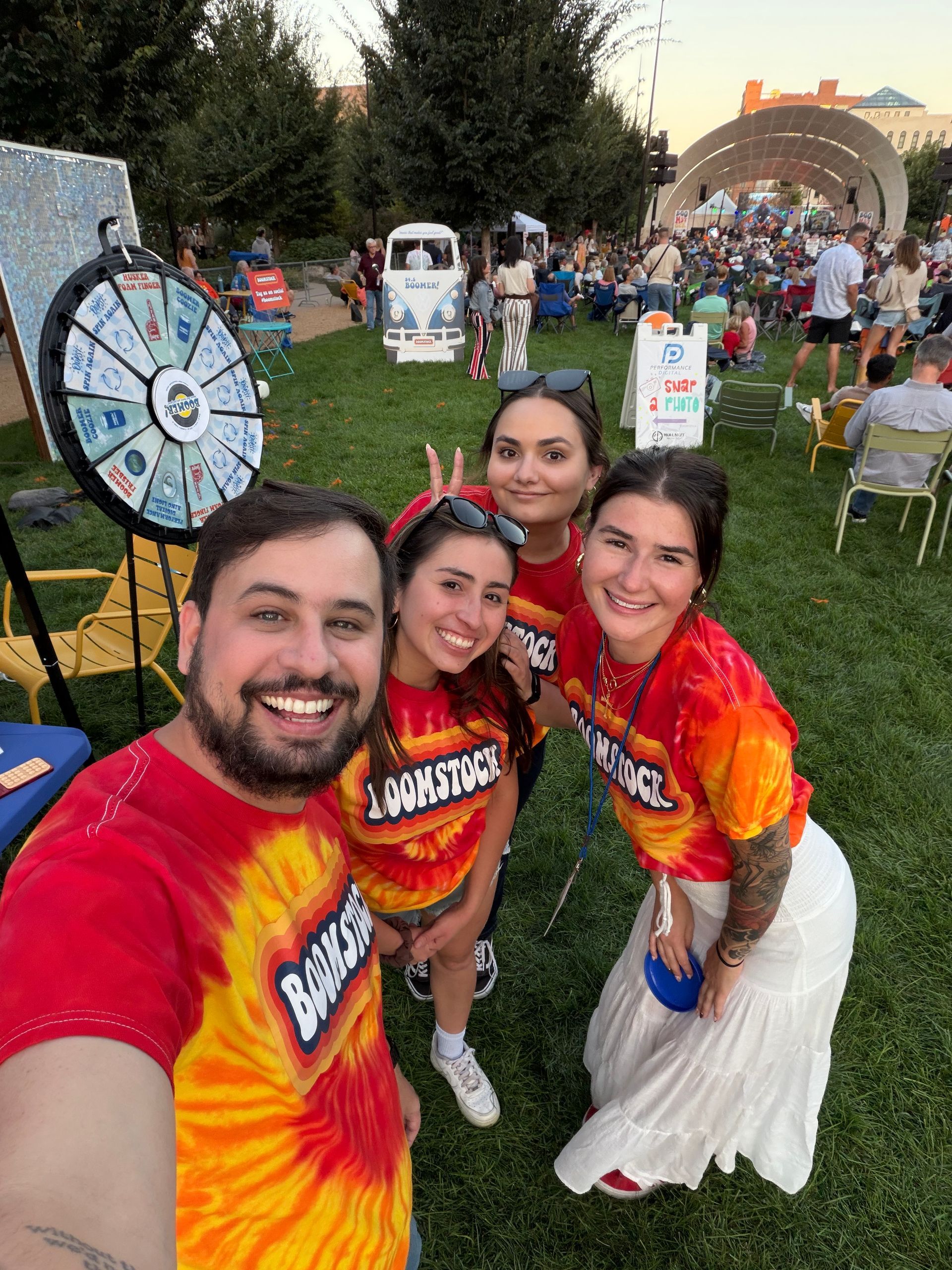 A woman in a santa hat is petting a pony.