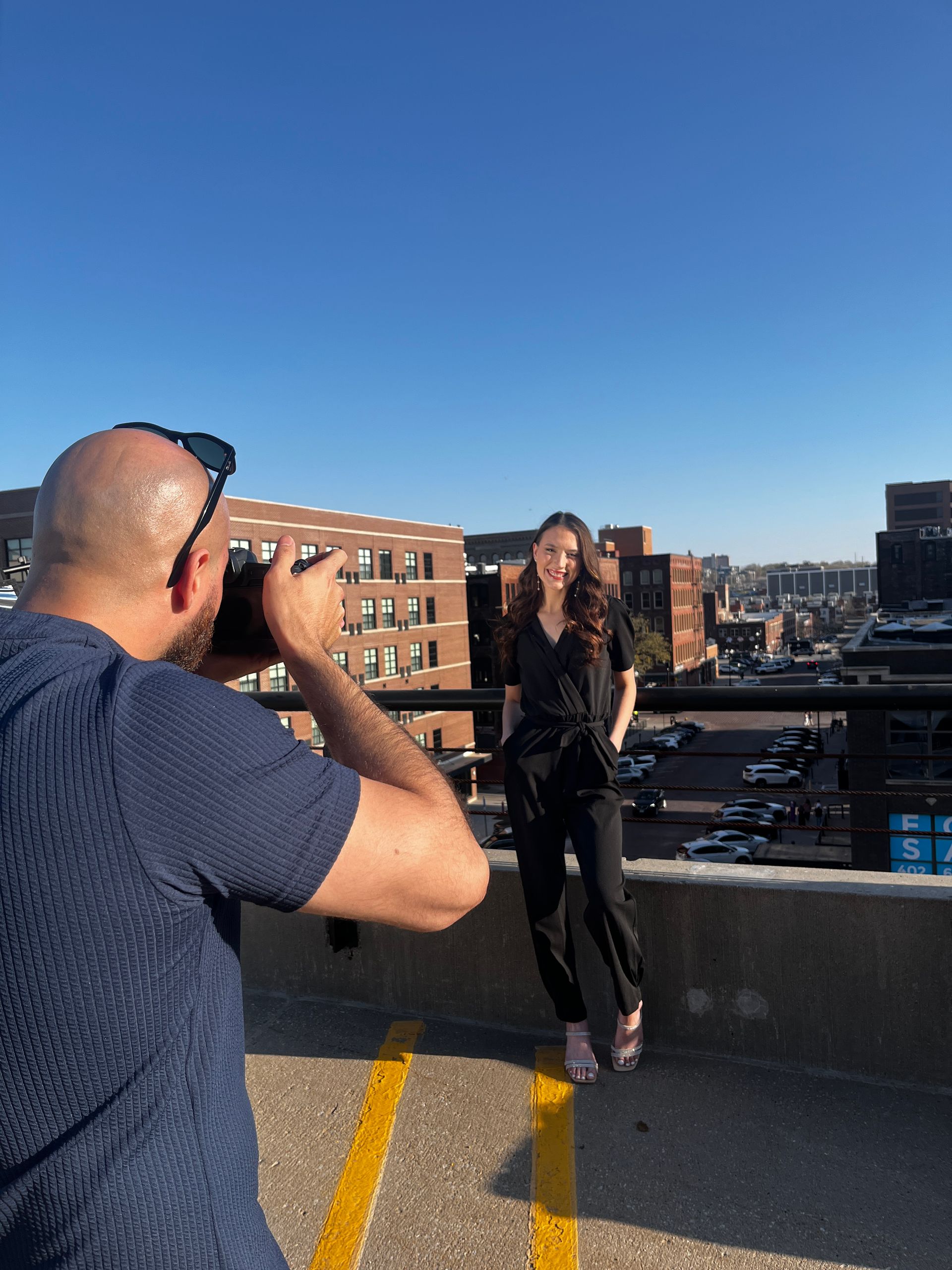 A group of people are posing for a picture in a seating room.