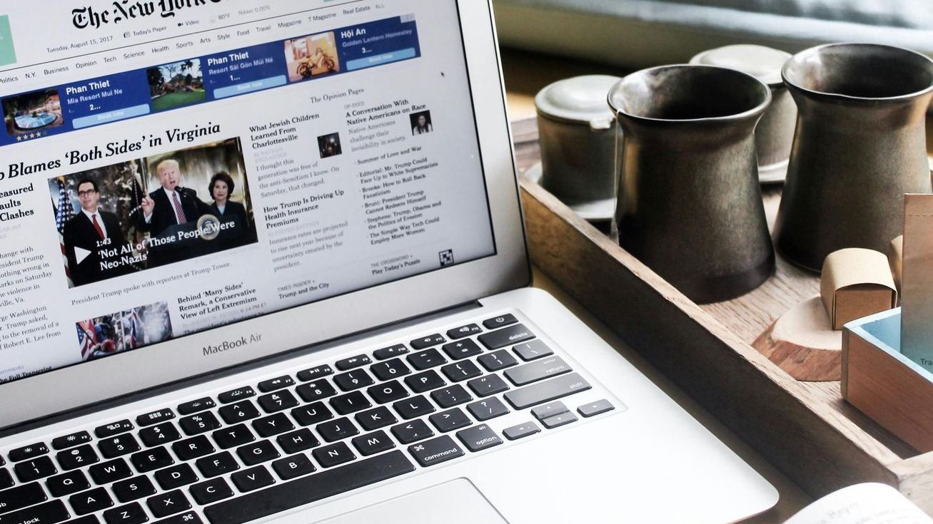 A laptop is open to the new york times website