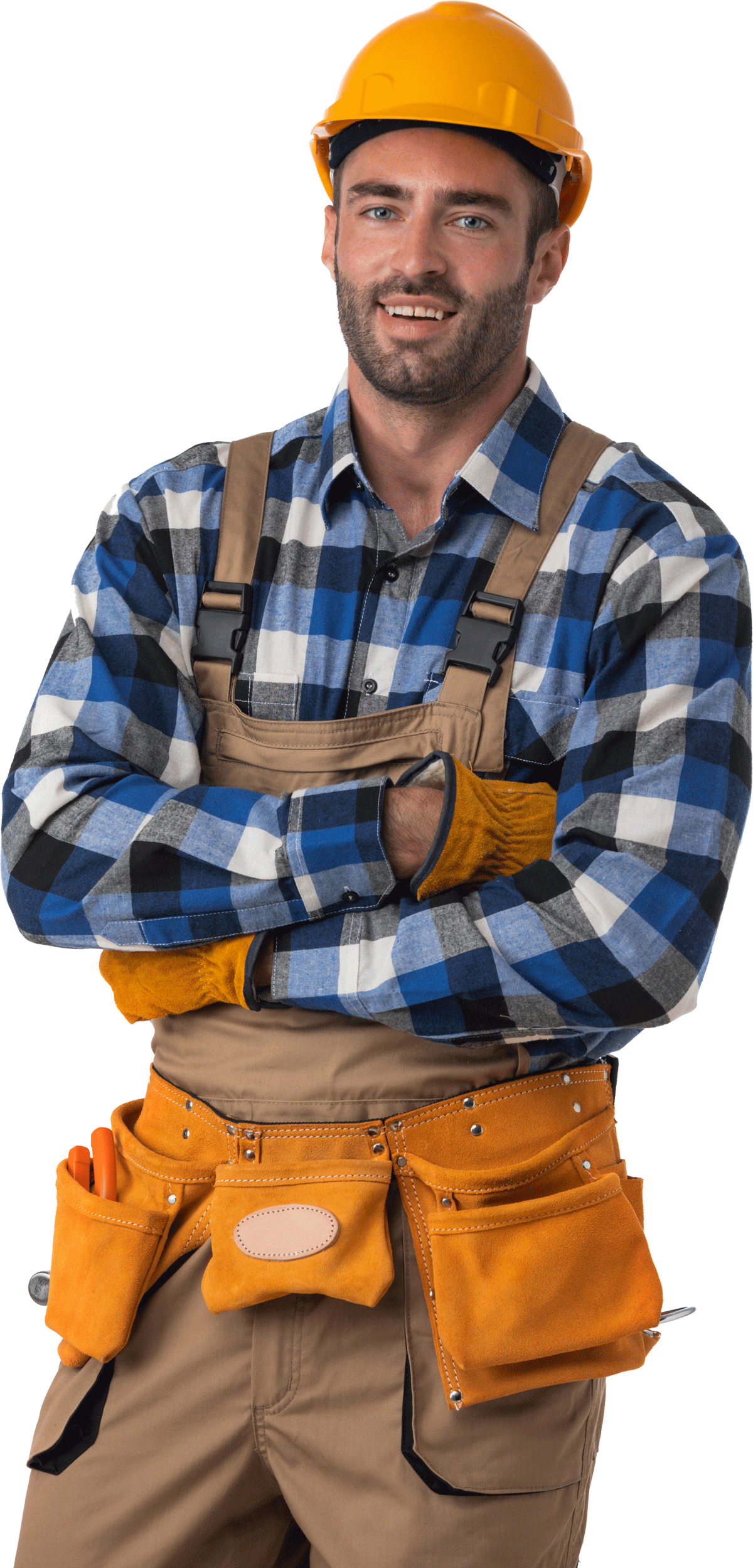 A man wearing a hard hat and overalls is standing with his arms crossed