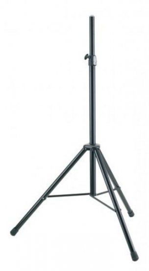 A black tripod is sitting on a white surface.