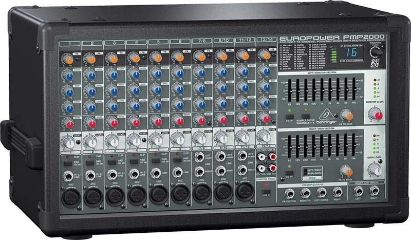 A behringer mixer is sitting on a white surface