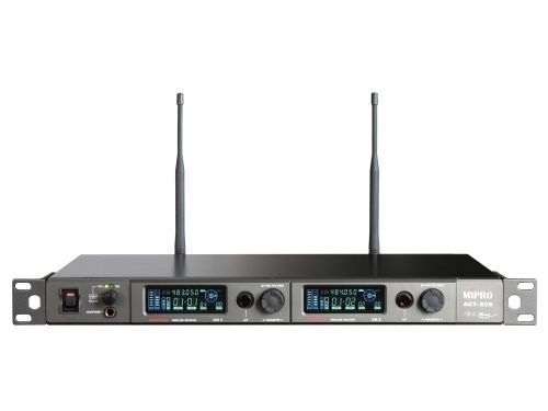 A pair of wireless microphones sitting on top of each other on a white background.