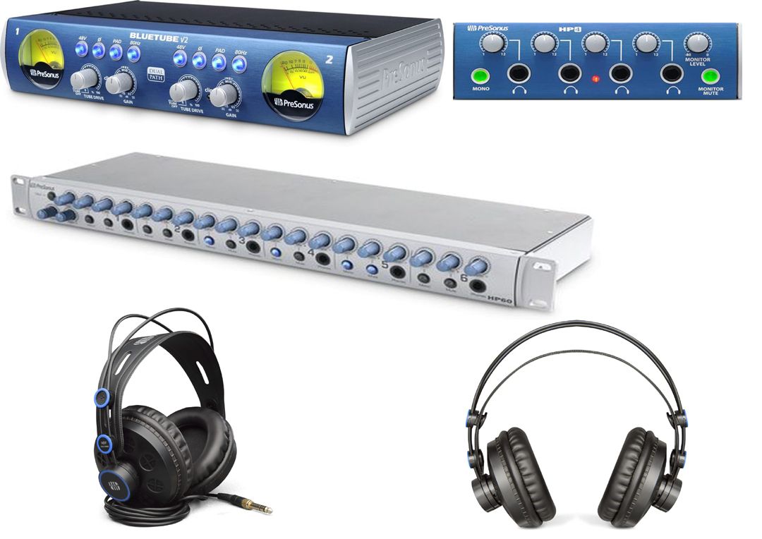 A pair of headphones sitting next to a sound card and a mixer.