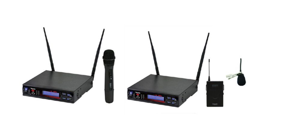 Three wireless microphones are sitting next to each other on a white background.
