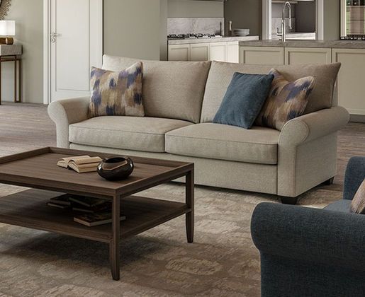 A living room with a couch and a wooden coffee table