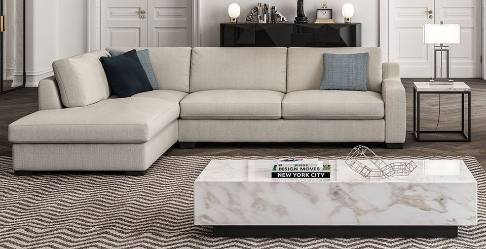 white sectional couch and a white coffee table.