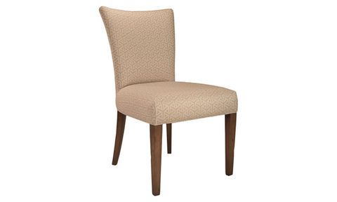 Upholstered dining chair with tan patterned fabric