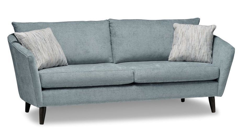 A blue couch with two pillows on it