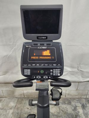 A exercise bike with a monitor on top of it.