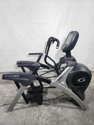 A cybex arc trainer is sitting on top of a concrete floor.