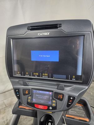 A close up of a treadmill with a screen on it.