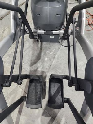 A close up of an elliptical machine in a gym.