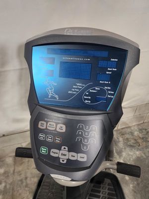 A close up of a rowing machine with a large screen.