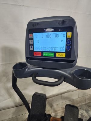 A close up of a treadmill with a blue screen.