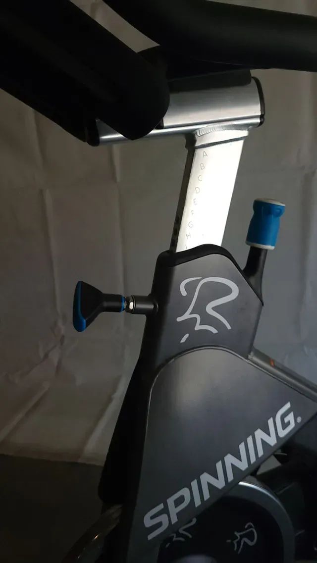 A close up of a spinning bike on a table.