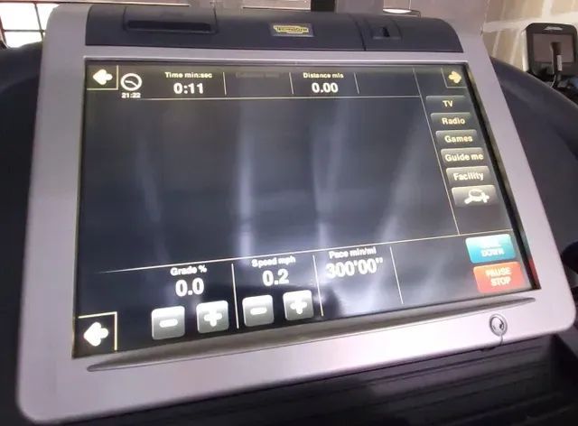 A monitor on a treadmill shows the time as 1:11