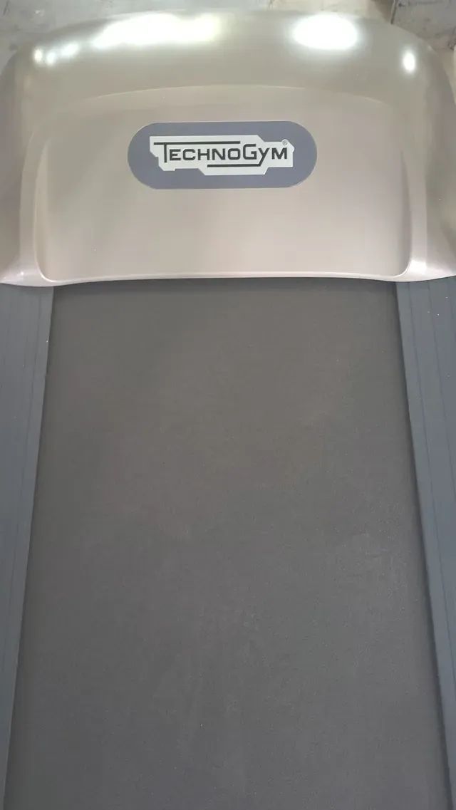 A close up of a treadmill with a logo on it.