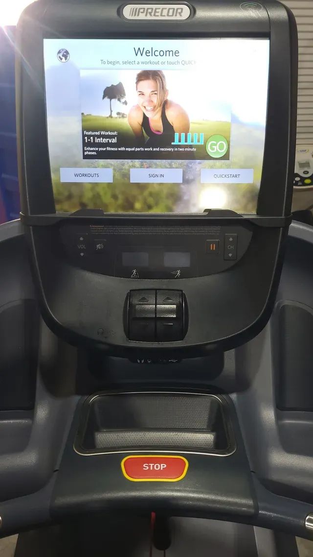 A treadmill with a large screen on top of it.