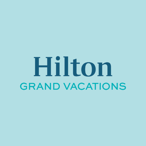 A logo for hilton grand vacations on a blue background