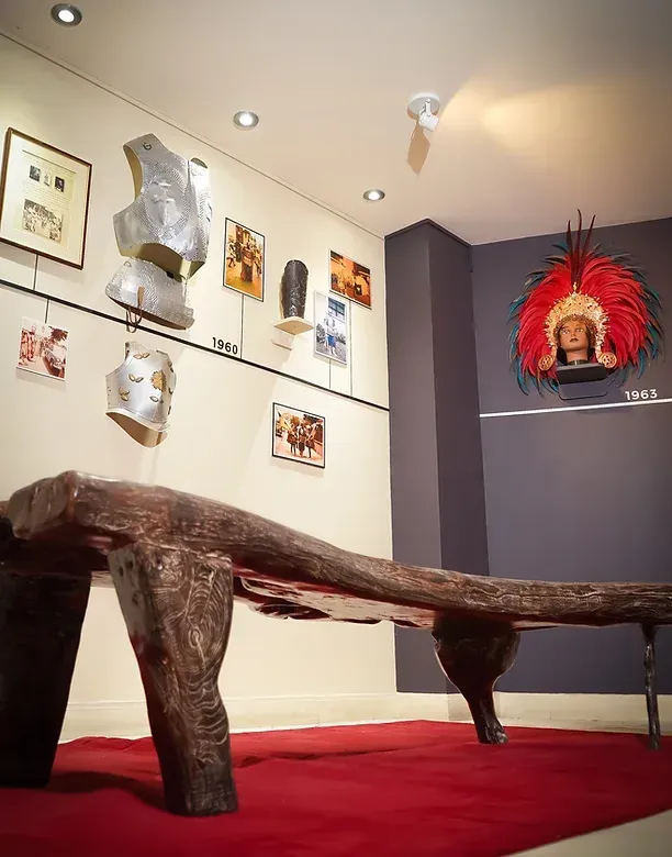 A room with a bench and a painting on the wall