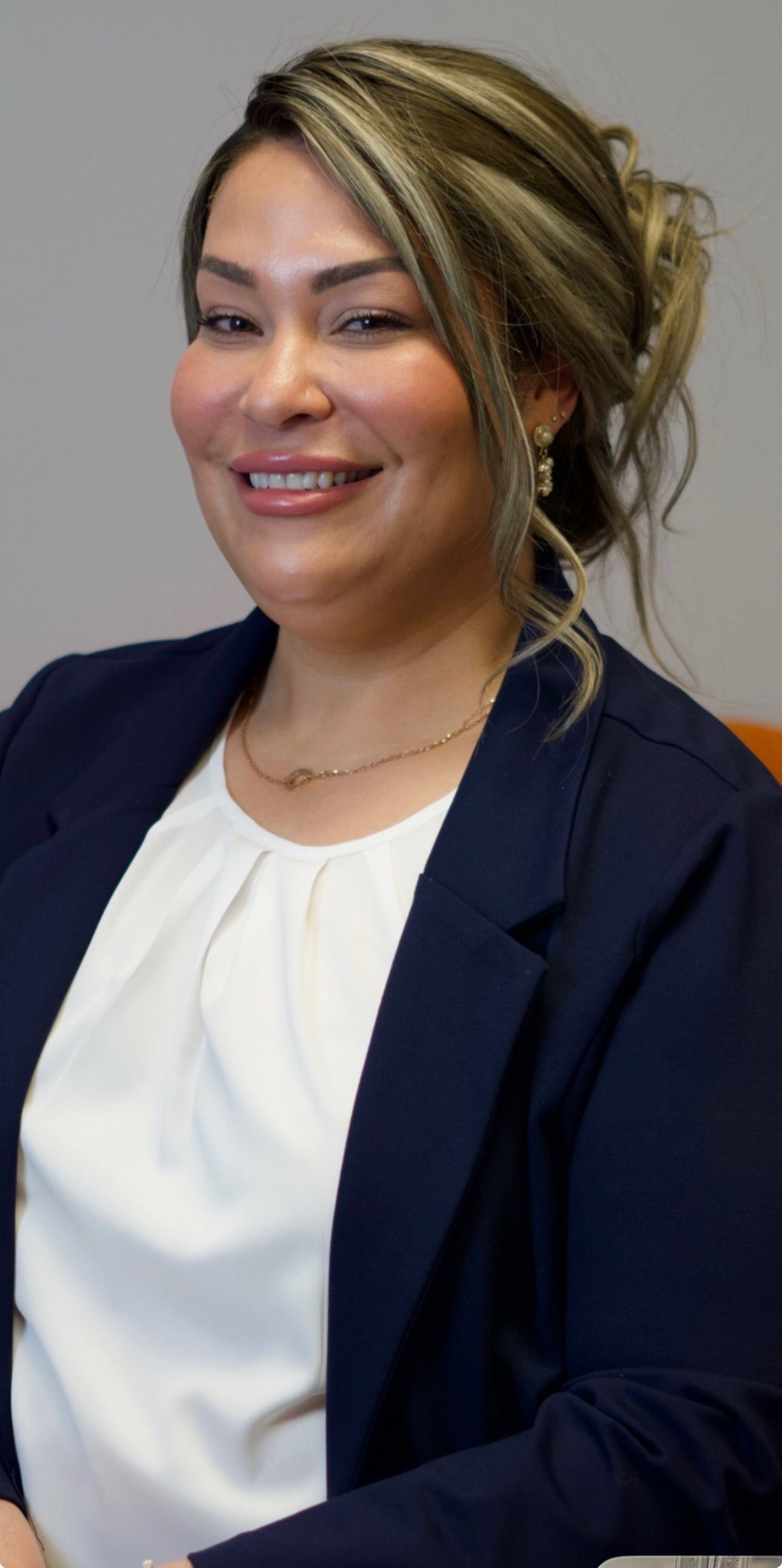 Two people holding hands, offering comfort or support.