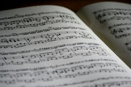 Open book with sheet music on the pages.