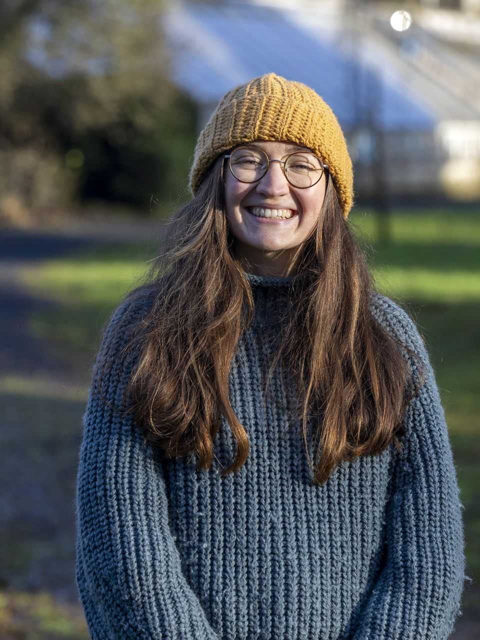 Picture of woman in the garden smiling to camera
